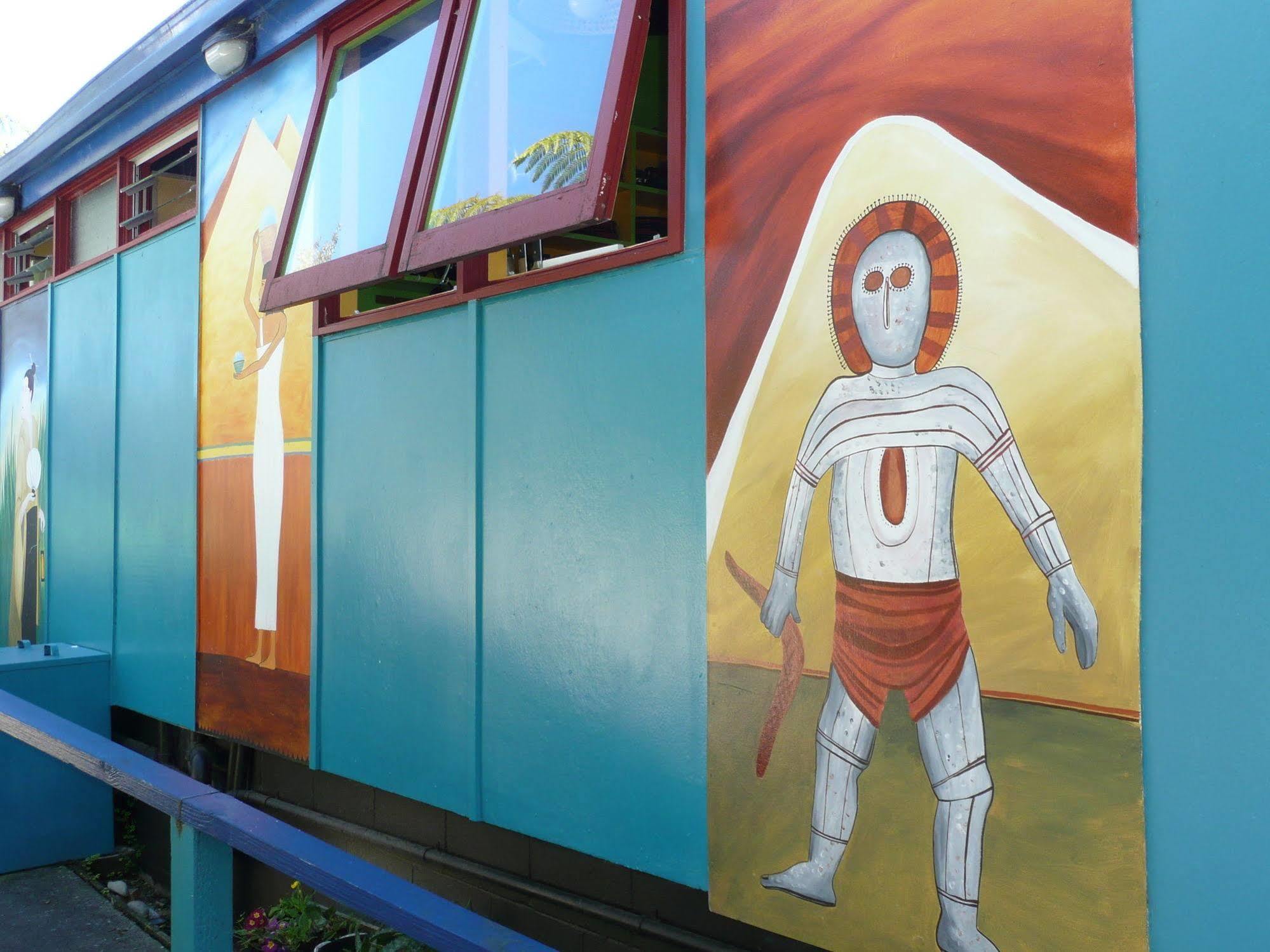 Global Village Travellers Lodge Greymouth Eksteriør bilde The Tin Man, a character from The Wizard of Oz, is depicted on the side of the Tin Man Motel in Clinesville, Texas.